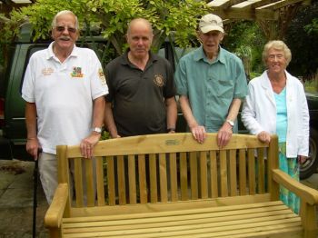 Exeter West club Lions Standing behind new bench that we donated to