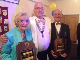 Lion Mais Crowley and Lion David Gubbin receiving their MJF awards from DG Fred Broome