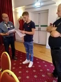 Lion President Martin,enrolling Danny Moxey into Exeter West Lions club